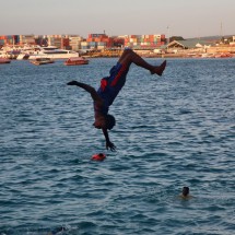 Boy with the port of Zanzibar City in the background